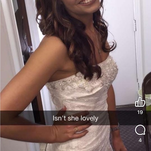 David's Bridal Lace Strapless Wedding Gown in the color “Ivory”. - Picture 10 of 16